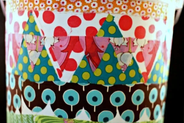 What to Decoupage | This great idea is a 5 gallon bucket turned craft room trash can! Get creative with Mod podge.