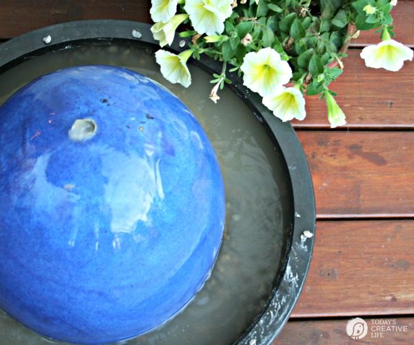 DIY Fountain | Water Fountain Feature for the backyard or patio. Make your own garden fountain with this simple tutorial. Click on the photo the tutorial. TodaysCreativeLife.com