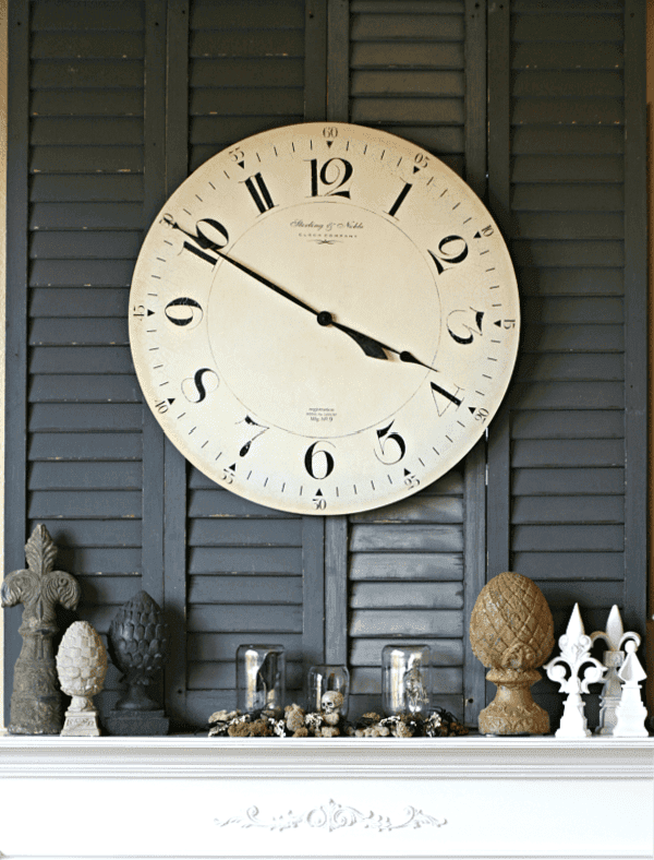 Halloween decorated Mantle with large clock.