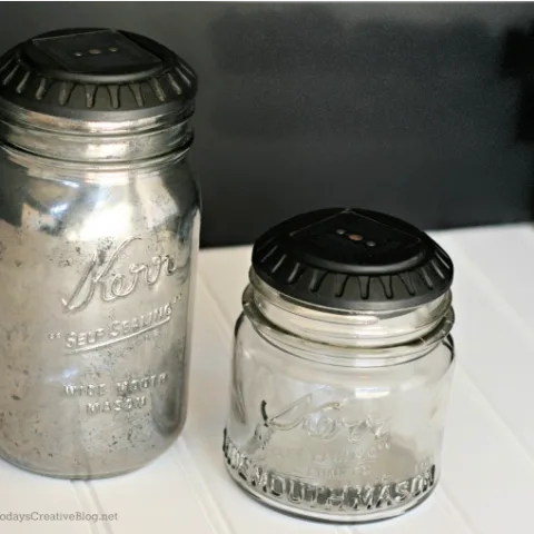 2 DIY Glass Jar solar lights. Solar light tops sitting on top of a glass jar.