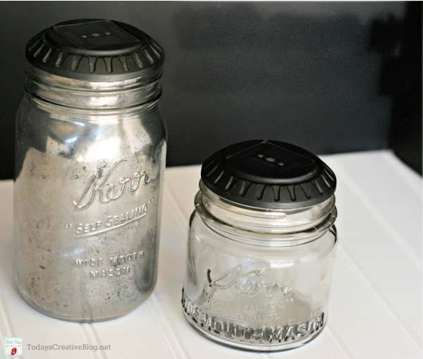 2 DIY Glass Jar solar lights. Solar light tops sitting on top of a glass jar.