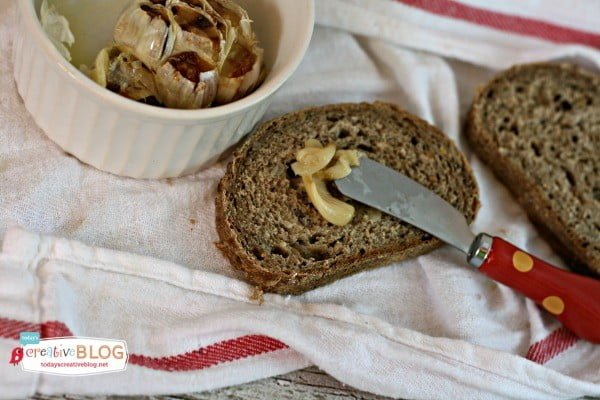 Spreading roasted garlic on bread | TodaysCreativeBlog.net