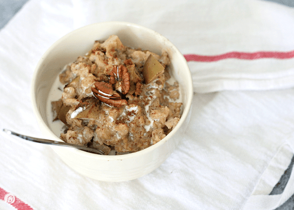 Bowl of oatmeal with pecans on top
