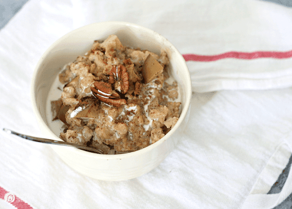 Bowl of oatmeal with pecans on top