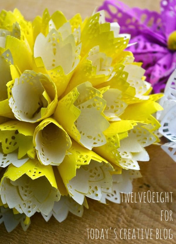 DIY Paper Doily Flowers | Paper flowers are easy to make! Instead of using tissue, we're using doilies. See the step by step tutorial on TodaysCreativeLife.com