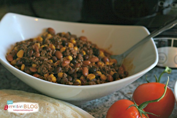 slow cooker taco meat in a white bowl