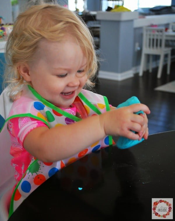 toddler girl playing with homemade play-doh