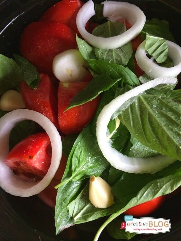 Ingredients for making homemade tomato sauce. Tomatoes, Onions, Garlic, Basil