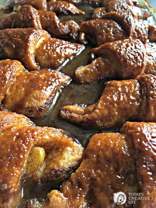 homemade apple dumplings covered in a sweet sauce