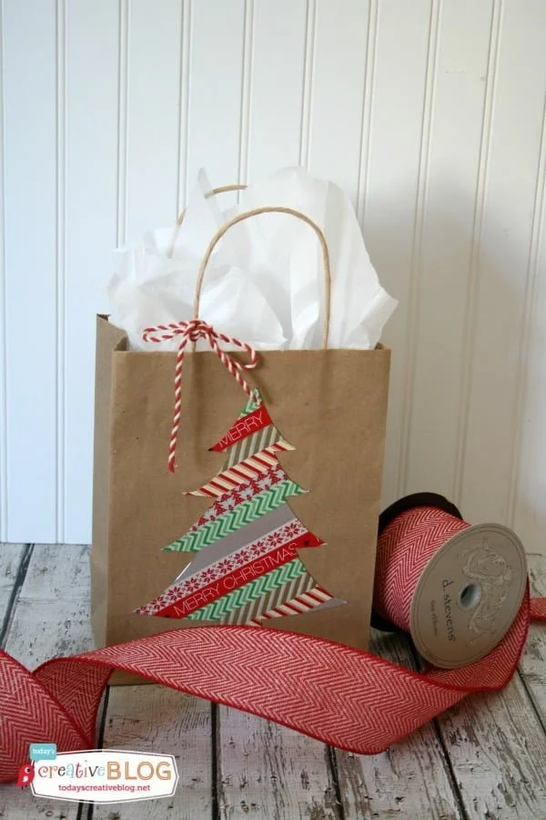 Easy DIY Gift Wrap | Quick and easy holiday gift wrapping using gift bags, glitter and washi-tape! Create your own templates and create simple fun designs! See a full tutorial on TodaysCreativeLife.com