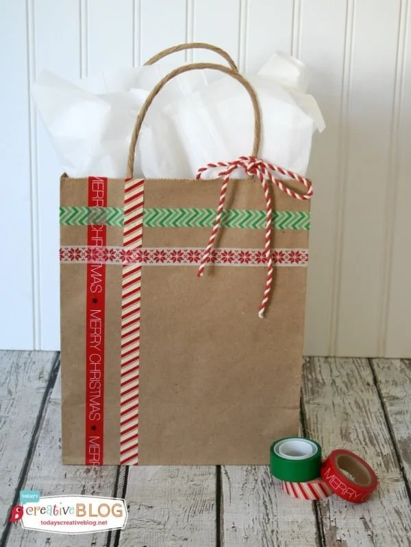 Easy DIY Gift Wrap | Quick and easy holiday gift wrapping using gift bags, glitter and washi-tape! Create your own templates and create simple fun designs! See a full tutorial on TodaysCreativeLife.com