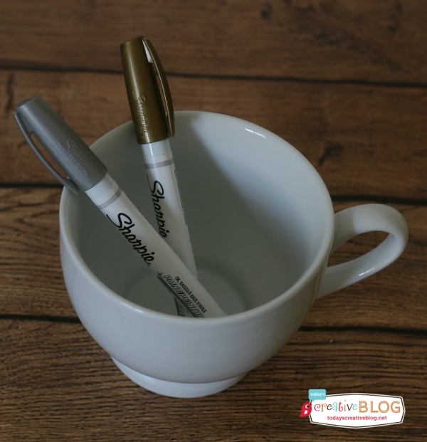 White mug with gold and silver sharpie paint pens. Sharpie Painted Mug | TodaysCreativeBlog.net