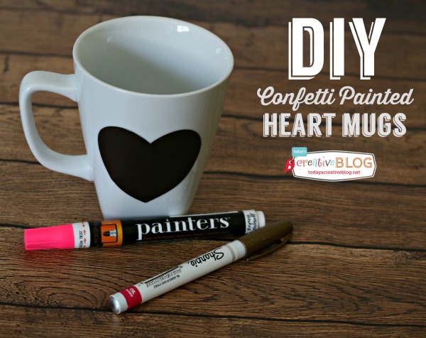 DIY Confetti Painted Heart Mugs | White mug with a black sticker heart with paint pens for painting on mug