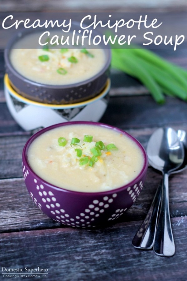Delicious Creamy Chipotle Cauliflower Soup served in two bowls and garnished with green onion.