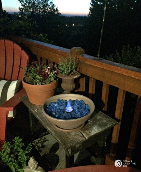 Small table top fire bowl on patio at night