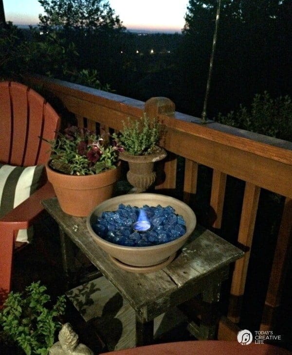 Small table top fire bowl on patio at night