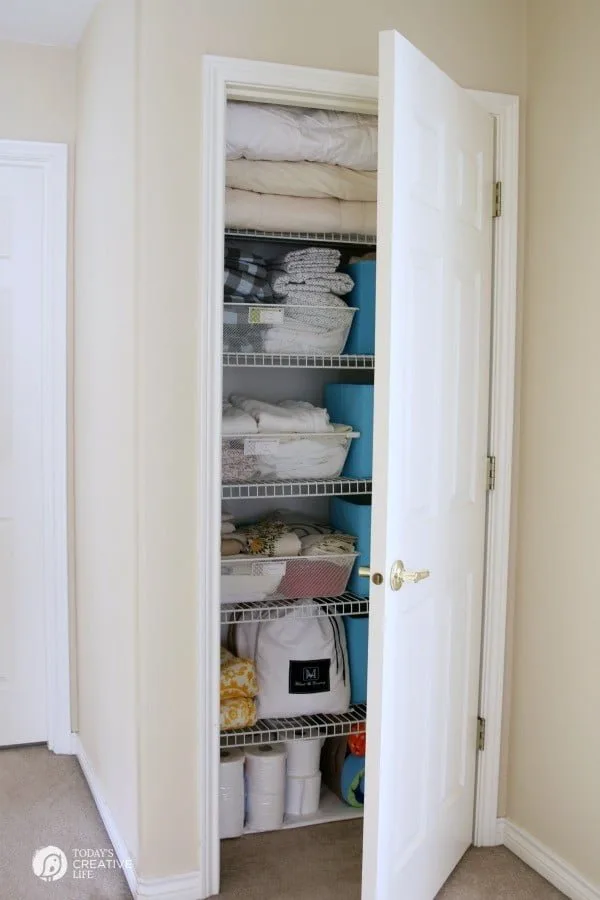 Organized Linen Closet for Real Life | Functional and pretty rarely collide, organize a linen closet for real life isn't going to be magazine ready, but you'll love it! See more on TodaysCreativeLife.com