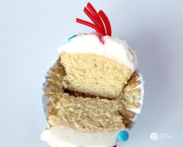 Cut in half Buttermilk Firecracker Cupcakes to show the moist center.