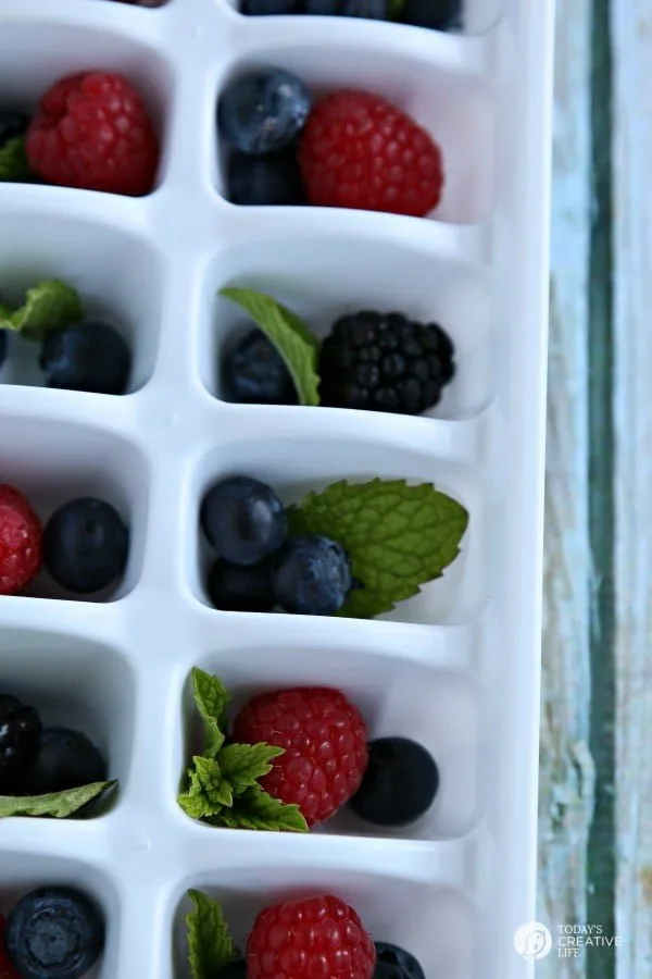 Fruit Filled Ice Cubes with Mint - Berry filled Ice cubes for fun entertaining. Great for 4th of July | See more on TodaysCreativeLife.com