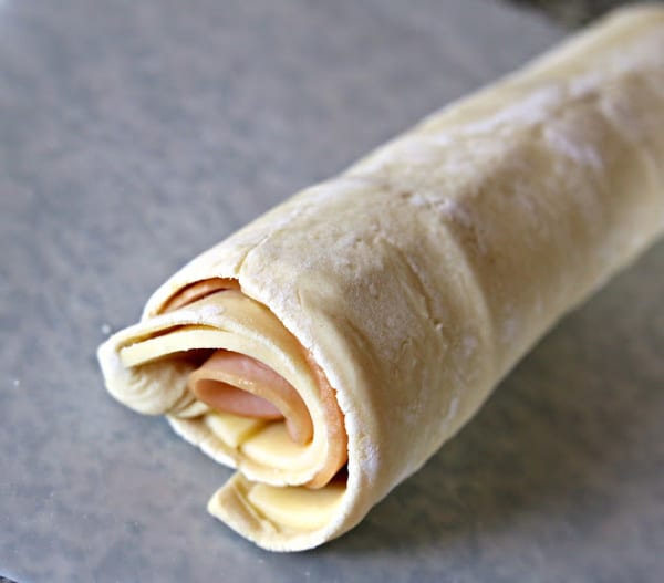 rolled up dough with turkey and cheese inside.