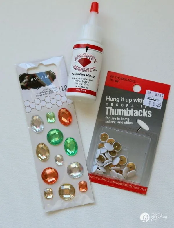 DIY Jewel Thumbtacks | This easy, quick and beautiful craft brings more personality to your bulletin board! Transform a boring and drab thumbtack into an attention getting push pin. See more on TodaysCreativeLife.com