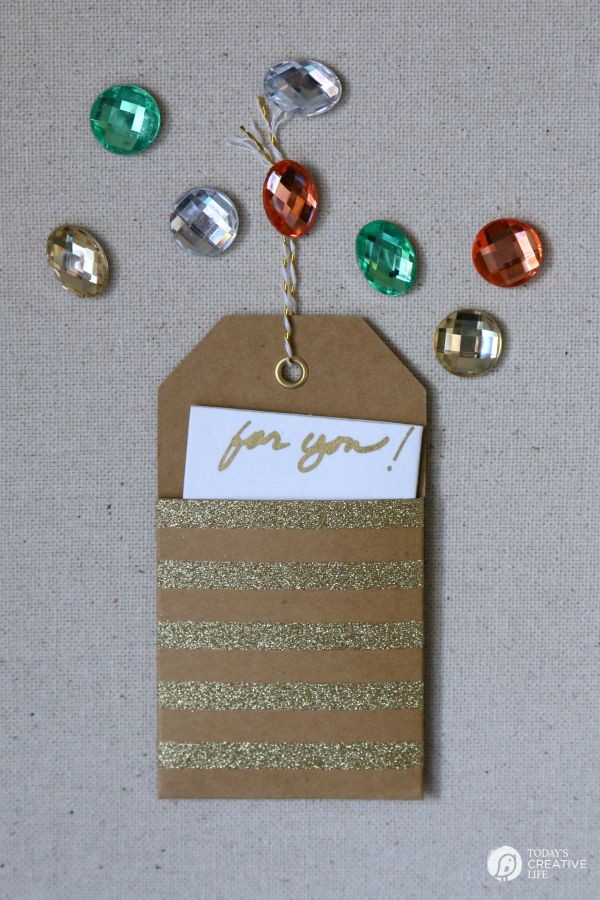 DIY Jewel Thumbtacks | This easy, quick and beautiful craft brings more personality to your bulletin board! Transform a boring and drab thumbtack into an attention getting push pin. See more on TodaysCreativeLife.com