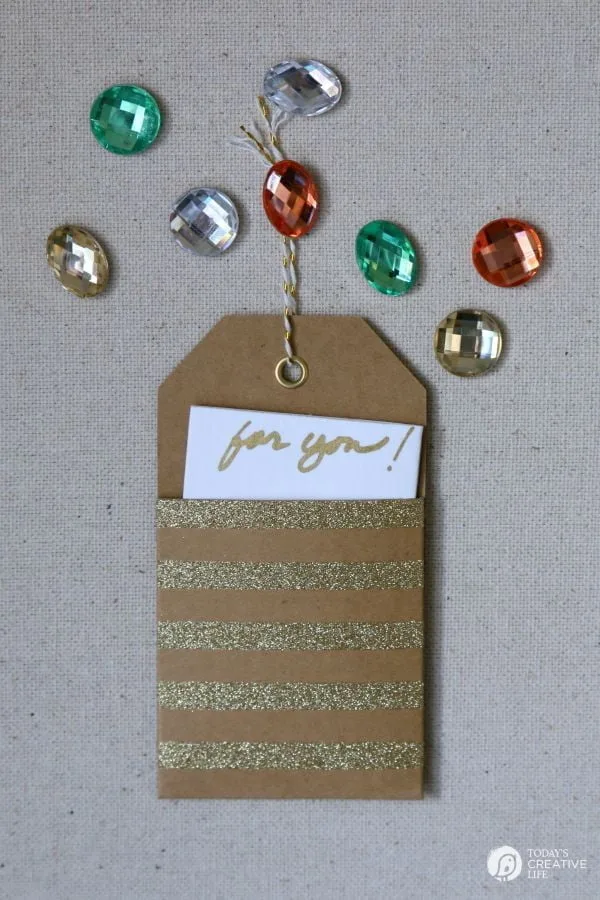 DIY Jewel Thumbtacks | This easy, quick and beautiful craft brings more personality to your bulletin board! Transform a boring and drab thumbtack into an attention getting push pin. See more on TodaysCreativeLife.com