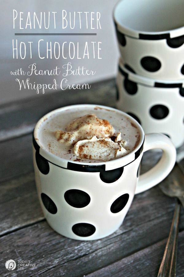 Peanut Butter Hot Chocolate with Peanut Butter Whipped Cream | Hot Chocolate with whipped cream in black and white polka dot mugs.