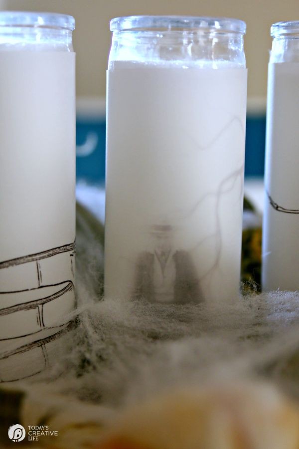 vellum candles - DIY Spooky Halloween Candles | Make simple Halloween Decor in minutes! Easy Halloween Table Centerpiece from TodaysCreativeLife.com