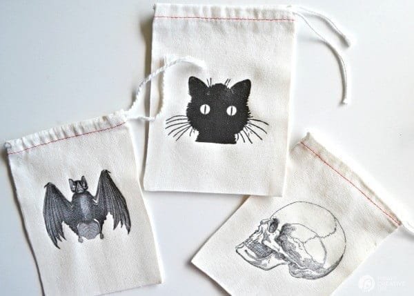 DIY Halloween Goodie Bags by BoxwoodAvenue.com for TodaysCreativeLife.com | Perfect for handing out special treats or use for a great Halloween party goodie bag. Easy iron on transfers make them extra spooky! 