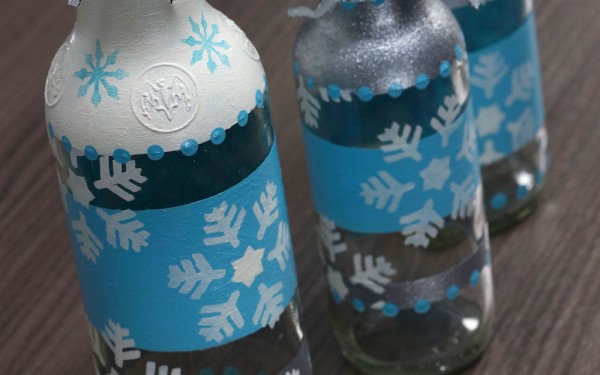 DIY Christmas Stenciled Bottle Craft by Amy Anderson | Bring on the glitter for this Easy DIY recycled bottle craft | See the full tutorial on TodaysCreativeLIfe.com