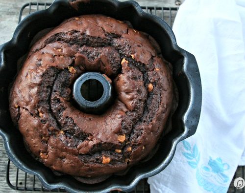 Chocolate Peanut Butter Chip Bundt Cake | Using a cake mix, instant pudding and a few other ingredients, makes this bundt cake the best cake recipe ever! Click the photo for the recipe!