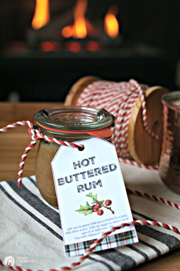 Small jar of hot buttered rum mix wrapped with gift tag. 