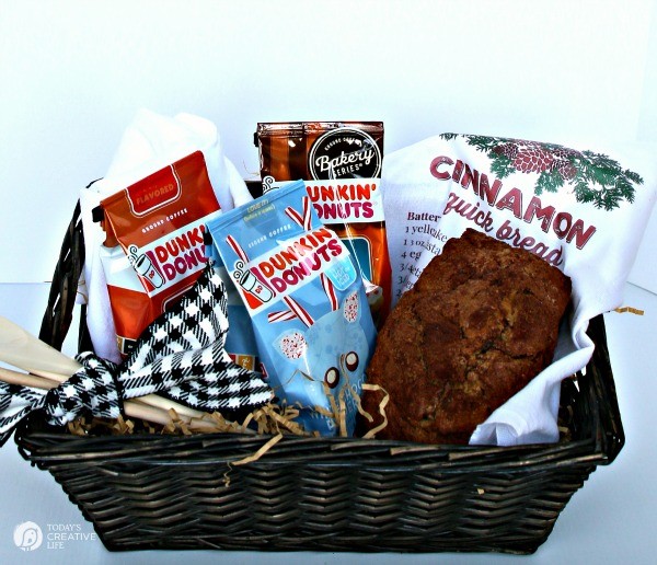 Gift basket with cinnamon bread, coffee and a dishtowel with the printed recipe. 