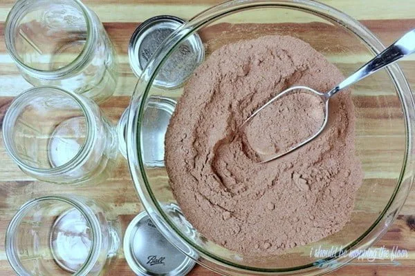 Spicy Mexican Hot Cocoa Mason Jar Gift by Kristi at I Should Be Mopping the Floor for The Creative Girls Holiday Soiree. This mason jar gift idea is the perfect gift from the kitchen. Great for neighbor gifts, teacher gifts or anyone! Get the recipe on TodaysCreativeLife.com