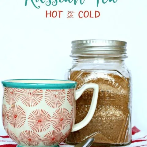 Russian Tea Drink Mix in a jar with a mug