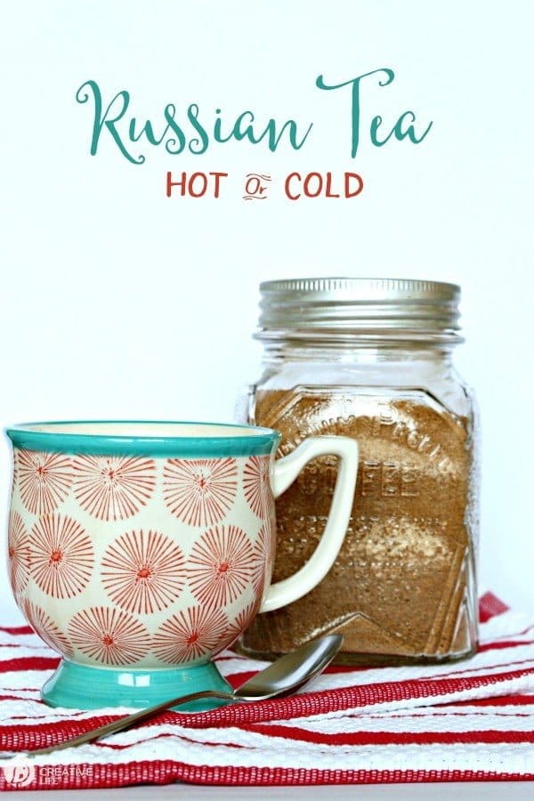 Jar with homemade Russian tea mix and coffee cup. 