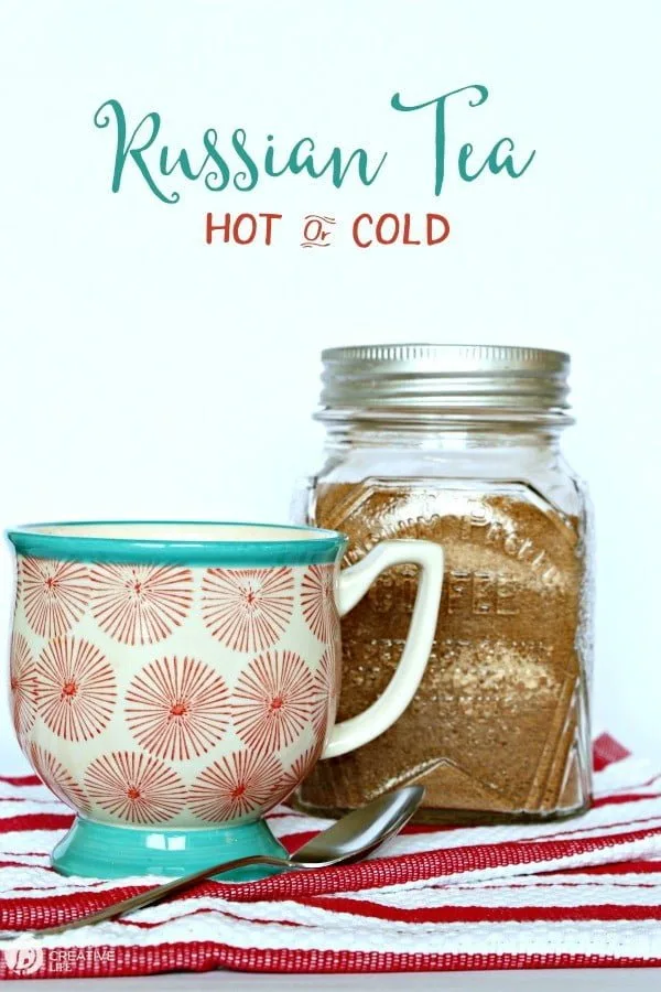 Jar with homemade Russian tea mix and coffee cup. 