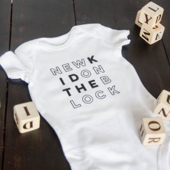 DIY Cricut Iron On Onesie | Creative contributor Lemon thistle has created this adorable custom designed baby onesie and is sharing the free graphic. Follow this easy tutorial by clicking on the photo. TodaysCreativeLife.com