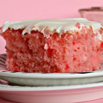 Strawberry Lemonade Cake | This is no ordinary cake, it's a strawberry lemonade poke cake that will delight your tastebuds! It's the perfect cake for spring time desserts. This doctored up cake box mix is the best short cut you'll ever take! Click the photo for the recipe! TodaysCreativeLife.com