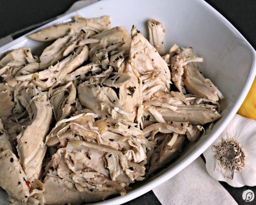 Crockpot Lemon Garlic Chicken | This recipe has 30 garlic cloves and makes the perfect shredded chicken for many meals. Use a whole chicken or just chicken breasts. Click on the photo for the recipe.