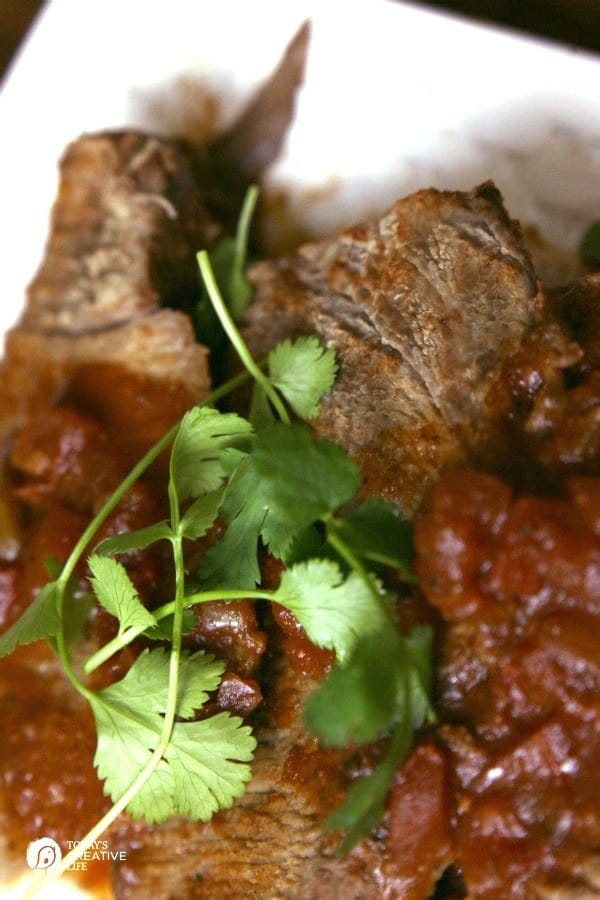 Slow Cooker Mexican Pot Roast | This crockpot pot roast is great shredded or sliced. Add more flavor for burritos, tacos, enchiladas or serve alone! Click on the photo for the recipe. 