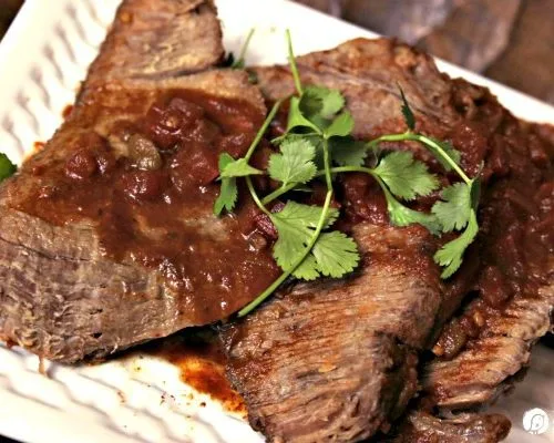 Slow Cooker Mexican Pot Roast | This crockpot pot roast is great shredded or sliced. Add more flavor for burritos, tacos, enchiladas or serve alone! Click on the photo for the recipe.