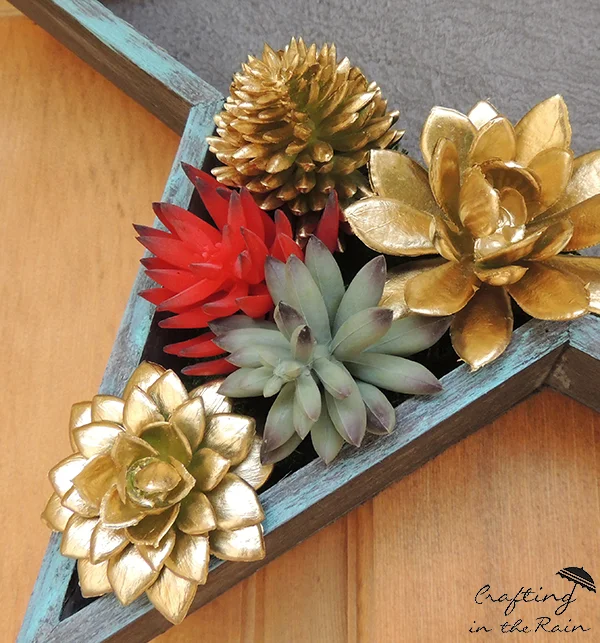 gold painted faux succulents for crafting a DIY Patriotic Door Decor