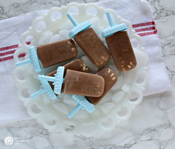 Chocolate Peanut Butter Fudgesicles | Make popsicles easily with TruMoo! Add peanut butter powder for the perfect blend! See the recipe on Today's Creative Life