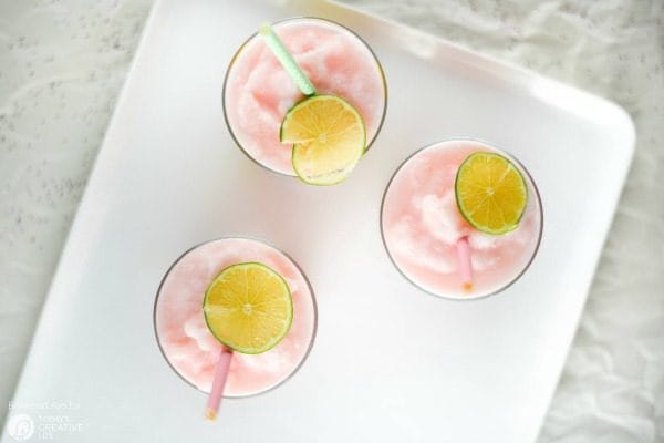 DIY Party Drinking Glasses - Flamingo & Pineapple | Create custom designs with your Cricut Explore, like these Flamingo and Pineapple party glasses. Quick and easy home and party ideas. See more on TodaysCreativeLife.com