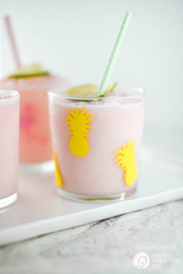 DIY Party Drinking Glasses - Flamingo & Pineapple | Create custom designs with your Cricut Explore, like these Flamingo and Pineapple party glasses. Quick and easy home and party ideas. See more on TodaysCreativeLife.com