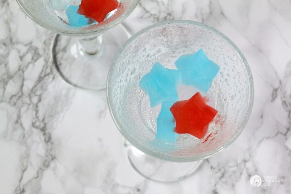 red and blue ice cubes in a glass