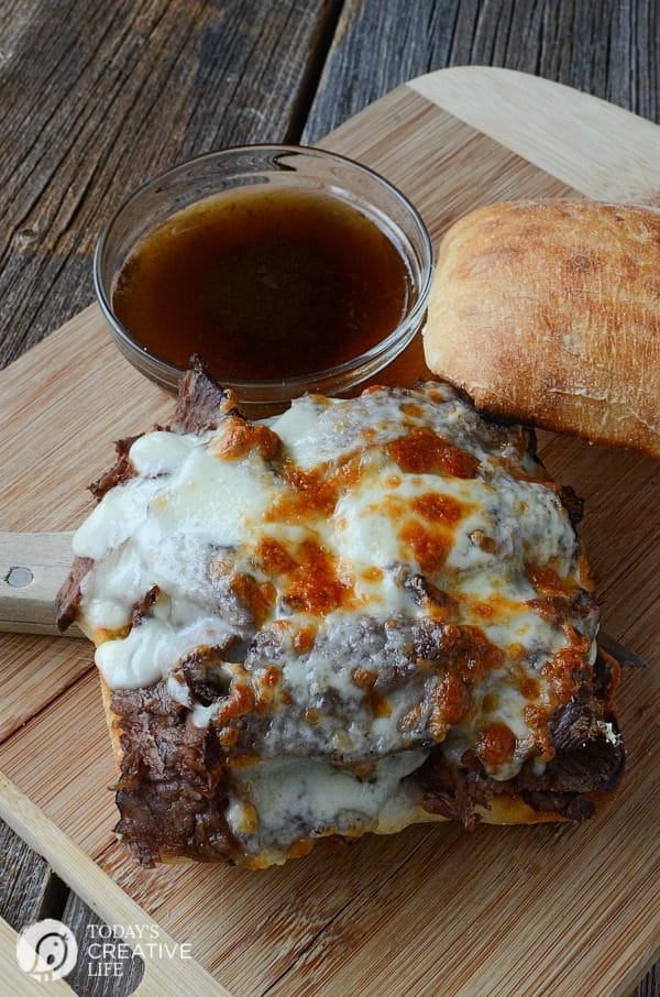 Slow Cooker Roast Beef Dip Sandwiches | This hearty crockpot recipes is for all french dip lovers! Served on a crisp ciabatta roll for extra crunch. Great for family dinners or weekend suppers. Get the recipe on TodaysCreativeLife.com