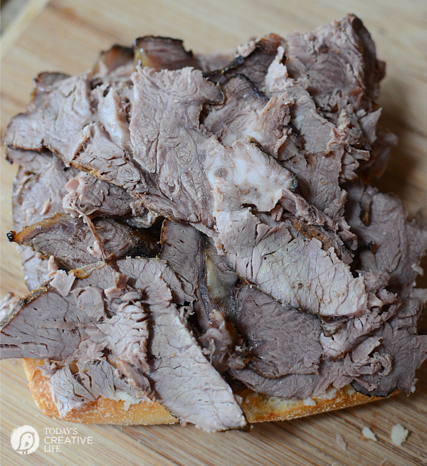 Slow Cooker Roast Beef Dip Sandwiches | This hearty crockpot recipes is for all french dip lovers! Served on a crisp ciabatta roll for extra crunch. Great for family dinners or weekend suppers. Get the recipe on TodaysCreativeLife.com